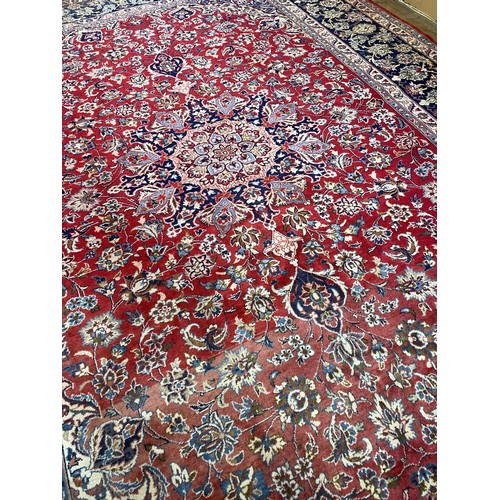 1742 - A Persian style red ground carpet, 390 x 297 cm