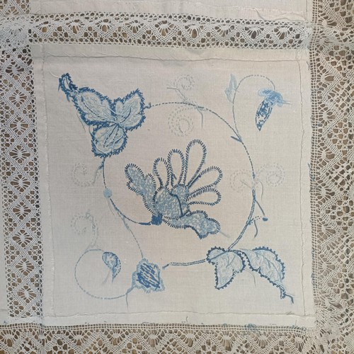 1429 - A table cloth, with blue embroidered decoration (box)