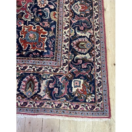 1623 - A Persian style red ground carpet, 336 x 240 cm