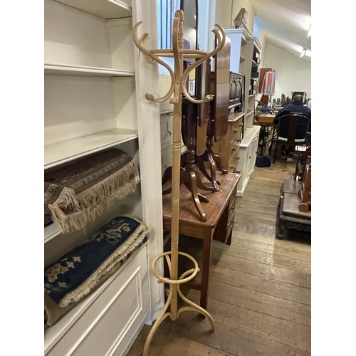 1666 - A mahogany tilt top table, 78 cm wide, another, a cheval mirror, a desk and a hat stand (5)