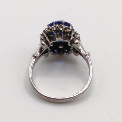 955 - A diamond and blue gem cluster ring