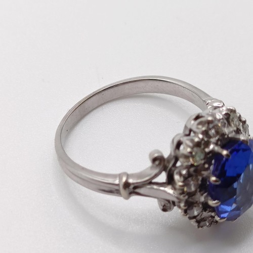 955 - A diamond and blue gem cluster ring