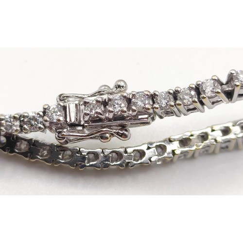 957 - A diamond tennis bracelet