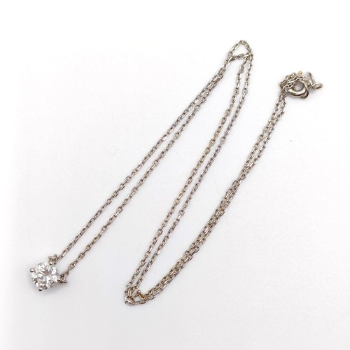 959 - An 18ct white gold and diamond pendant, on a chain