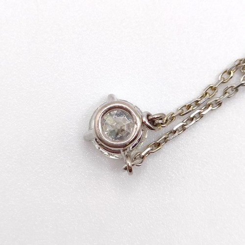 959 - An 18ct white gold and diamond pendant, on a chain