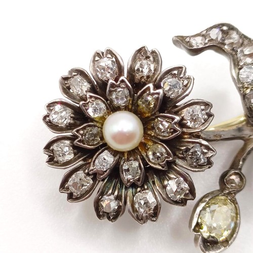 961 - An early 20th century diamond and pearl floral brooch