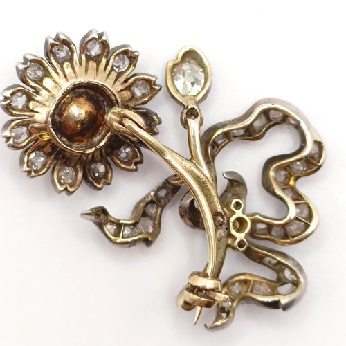 961 - An early 20th century diamond and pearl floral brooch