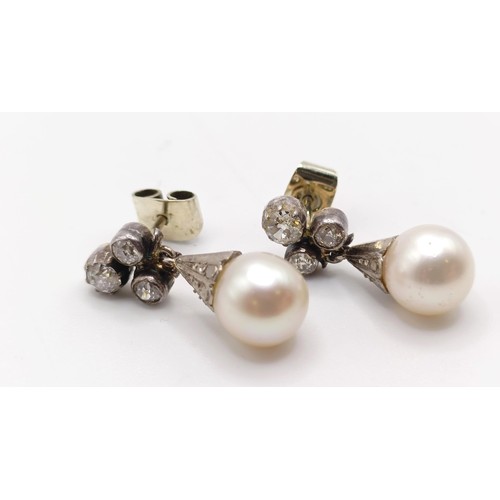 963 - A pair of late 19th/early 20th century pearl and diamond drop earrings