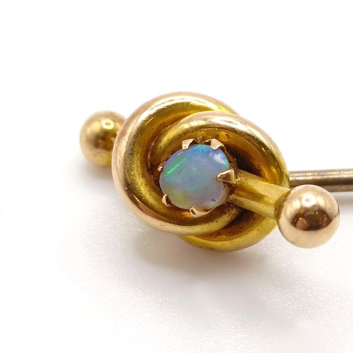 967 - A yellow metal and opal stick pin, and another (2)