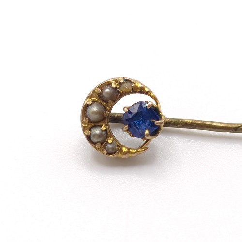 967 - A yellow metal and opal stick pin, and another (2)