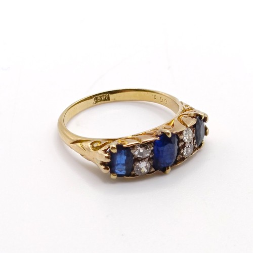 951 - An 18ct gold, sapphire and diamond ring, ring size Q