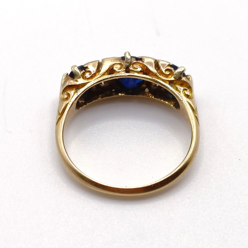 951 - An 18ct gold, sapphire and diamond ring, ring size Q