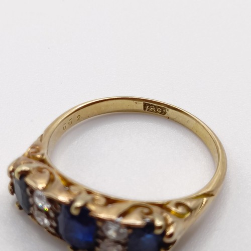 951 - An 18ct gold, sapphire and diamond ring, ring size Q