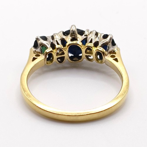 952 - An 18ct gold, sapphire and diamond ring, ring size N