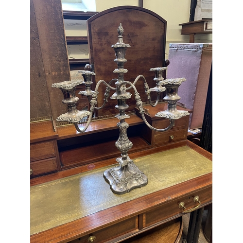 1389 - A silver plated four branch candelabrum, 56 cm high