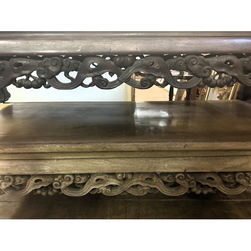 1671A - A pair of Chinese low tables, with carved friezes, 141 cm wide (2)