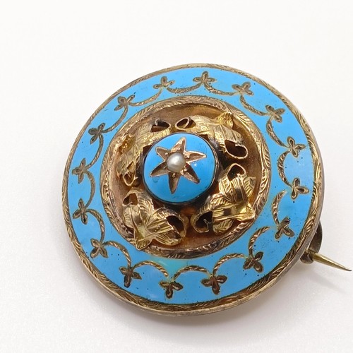 549 - A Victorian yellow coloured metal and blue enamel target memorial brooch