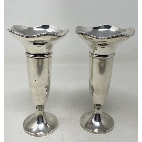 691 - A pair of Edward VII silver vases, Sheffield 1904, bases filled