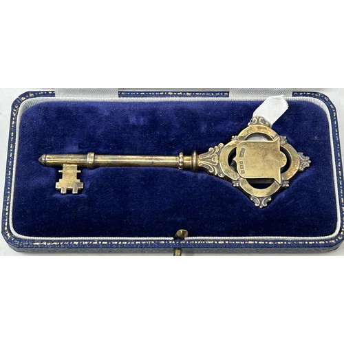 706 - A silver gilt presentation key, Birmingham 1957, cased