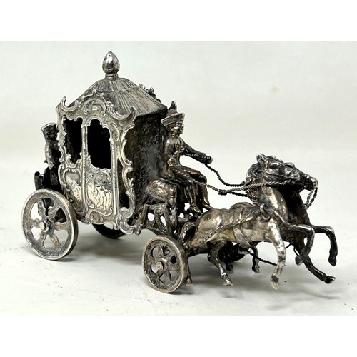 666 - A silver group of a coach and horses, with import marks, 10 cm, 139 g