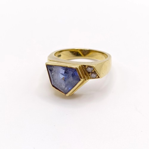 535 - An 18ct gold, blue tanzanite and diamond ring, ring size H