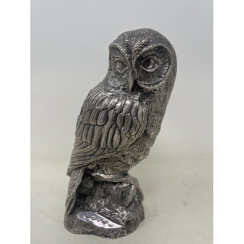 674 - A modern silver mounted figure of an owl, 16 cm high