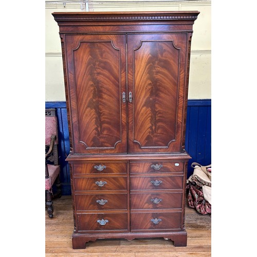 1044 - A mahogany TV cabinet, 100 cm wide, a mahogany washstand, 107 cm wide, a walnut sideboard, with a mi... 