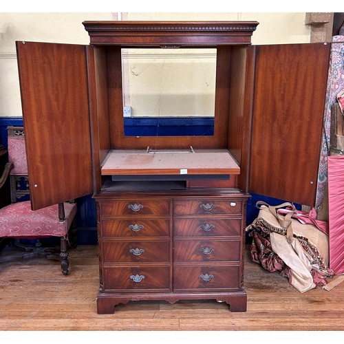 1044 - A mahogany TV cabinet, 100 cm wide, a mahogany washstand, 107 cm wide, a walnut sideboard, with a mi... 