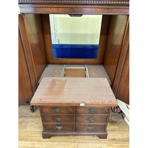 1044 - A mahogany TV cabinet, 100 cm wide, a mahogany washstand, 107 cm wide, a walnut sideboard, with a mi... 