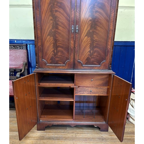 1044 - A mahogany TV cabinet, 100 cm wide, a mahogany washstand, 107 cm wide, a walnut sideboard, with a mi... 