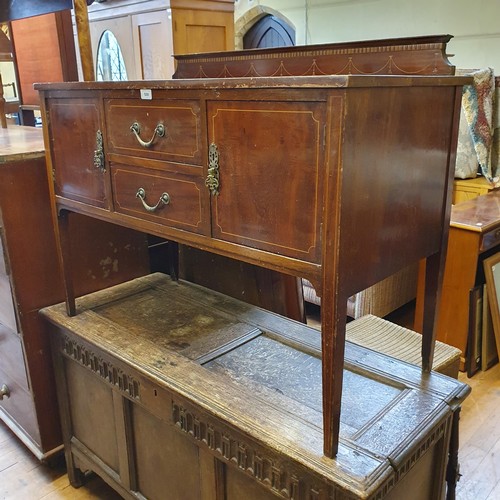 1044 - A mahogany TV cabinet, 100 cm wide, a mahogany washstand, 107 cm wide, a walnut sideboard, with a mi... 