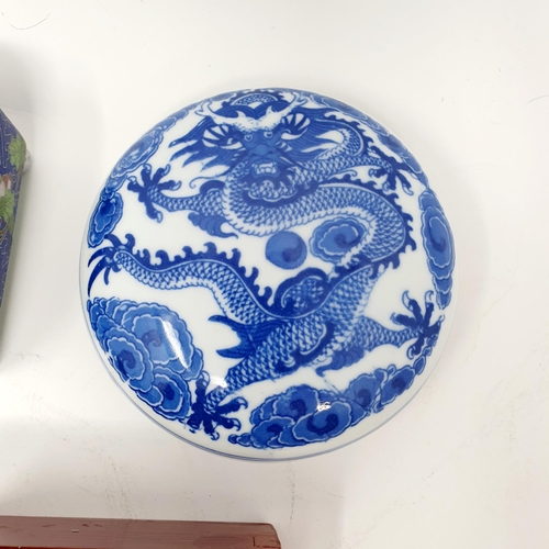 813 - A Chinese blue and white box and cover, decorated a dragon, 11 cm diameter, seven others, a Chinese ... 