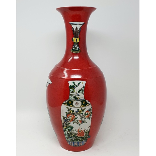 814 - A Chinese red ground vase, decorated vases, six character mark to base, 43 cm high, a Chinese print ... 