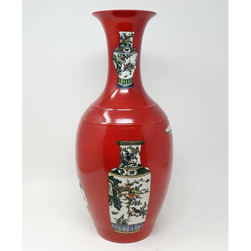 814 - A Chinese red ground vase, decorated vases, six character mark to base, 43 cm high, a Chinese print ... 