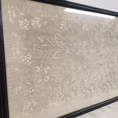 869 - A large silk embroidered panel, decorated flowers, 160 x 49 cm