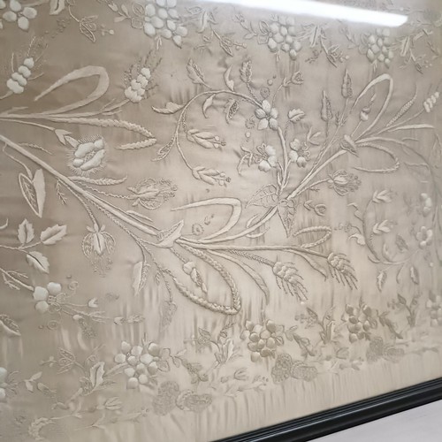 869 - A large silk embroidered panel, decorated flowers, 160 x 49 cm