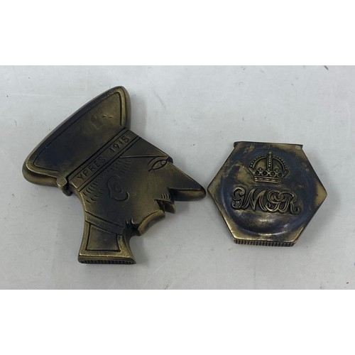 558 - A novelty brass vesta, in the form of a sailor, and another (2)