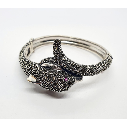 538 - A silver and marcasite dolphin form bangle