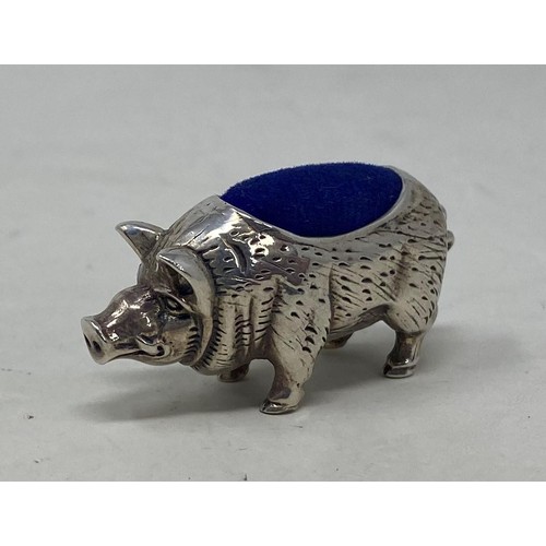 553 - A novelty silver pincushion, in the form of a pig