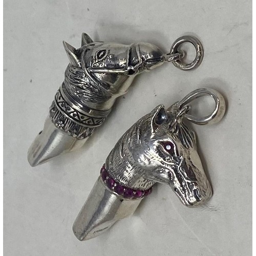 542 - A novelty silver whistle, in the form of a horse, and another (2)