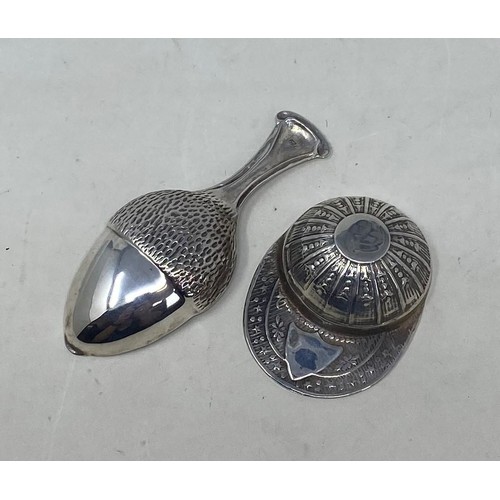 506 - A novelty silver caddy spoon, in the form of a cap, another in the form of an acorn (2)