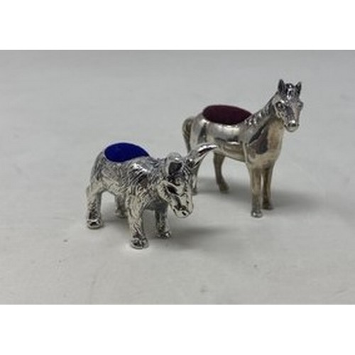 533 - A novelty silver pin cushion, in the form of a donkey, and another in the form of a horse (2)