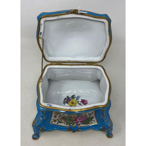 883 - A French style porcelain box, decorated flowers, highlighted in gilt, 19 cm wide