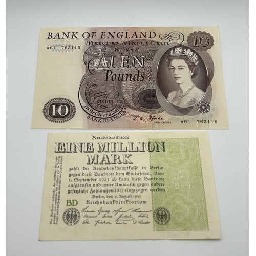 3 - A Bank of England white £5 banknote, March 27th 1950, R10 099867, a group of German 100,000 Mark ban... 