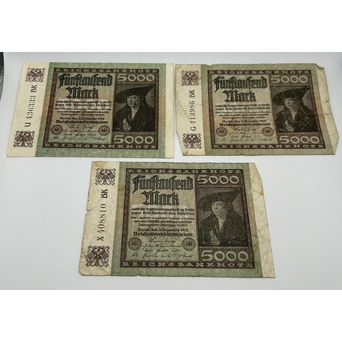 3 - A Bank of England white £5 banknote, March 27th 1950, R10 099867, a group of German 100,000 Mark ban... 