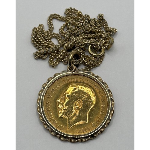 6 - A George V gold half sovereign, 1913, in a 9ct gold  pendant mount, on a 9ct gold chain