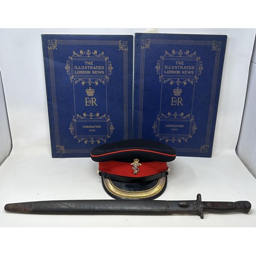 52 - A 1907 pattern bayonet, with a scabbard, a REME officers peaked cap, and two copies of The Illustrat... 