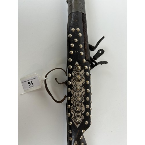 54 - A 19th century Moroccan flintlock gun, 145 cm long