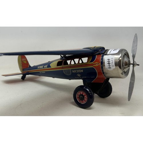 159 - A Japanese wind up tinplate aeroplane, 41 cm wide