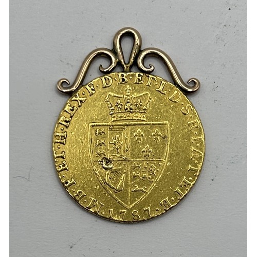 32 - A George III gold spade guinea, 1787, with a later yellow metal mount